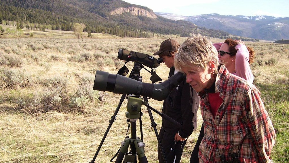 People looking into telescopes at Grand Teton National Park