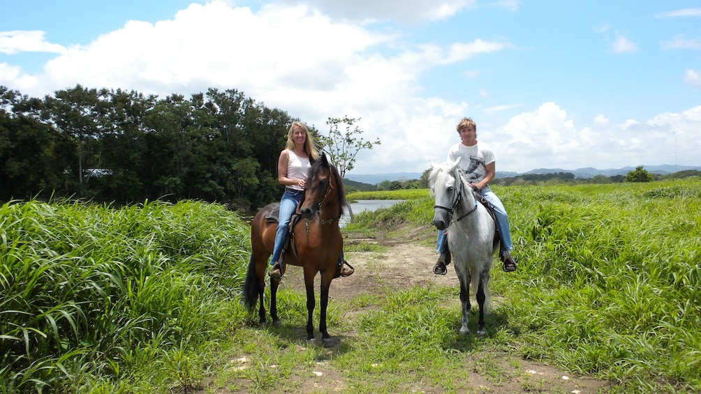 Couple on horses on the trail