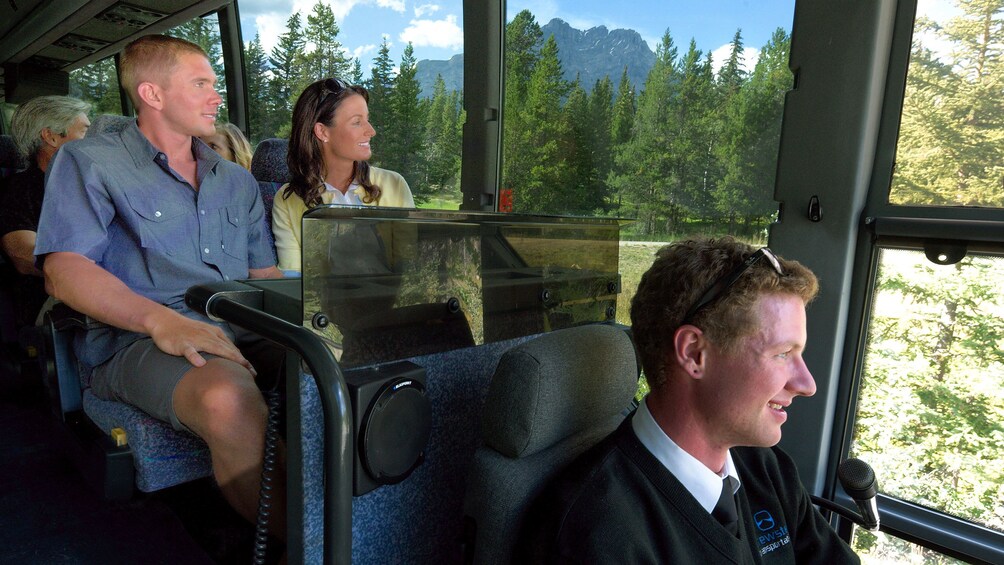 Guests enjoying the views of Jasper National Park from the windows of the tour bus