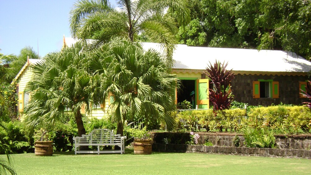 Colorful and historical Romney Manor and surrounding greenery in St Kitts