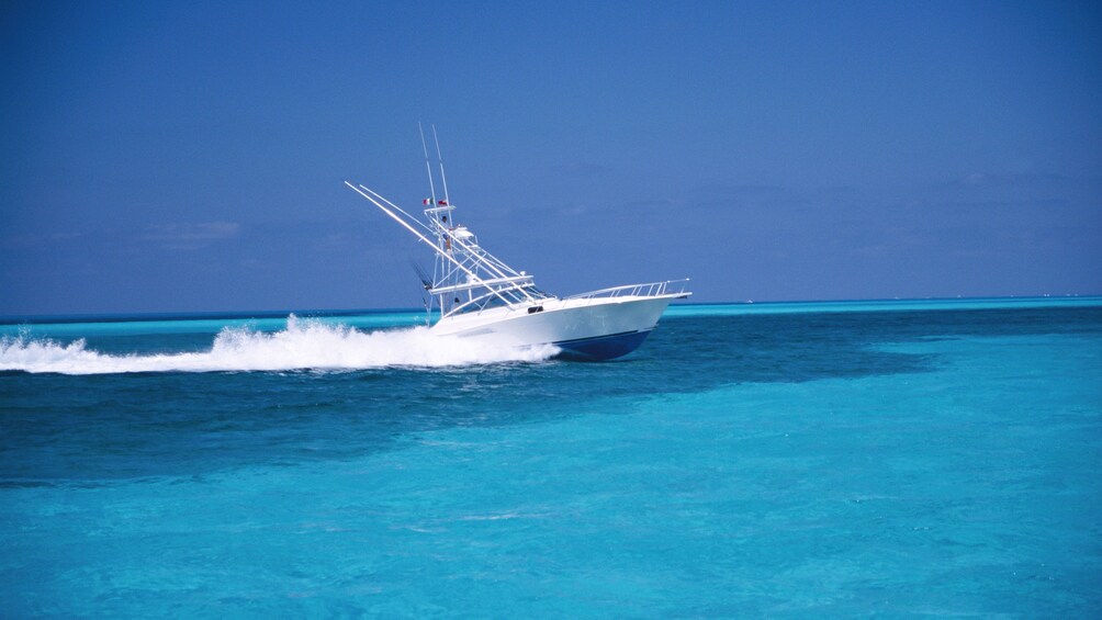 Deep sea fishing boat cruising through the water in St Kitts