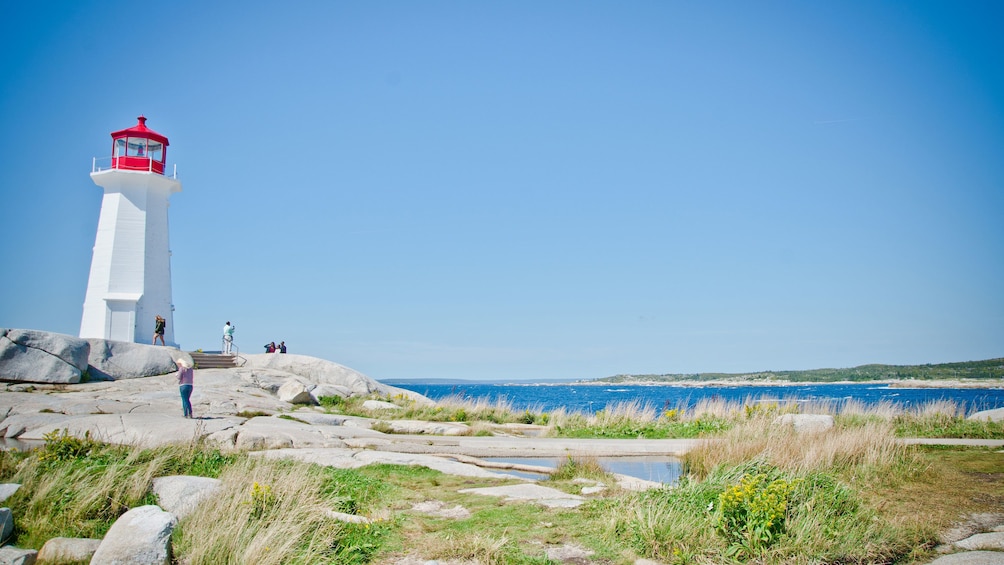 View of visitors at the lighthouse at Peggy's Cove