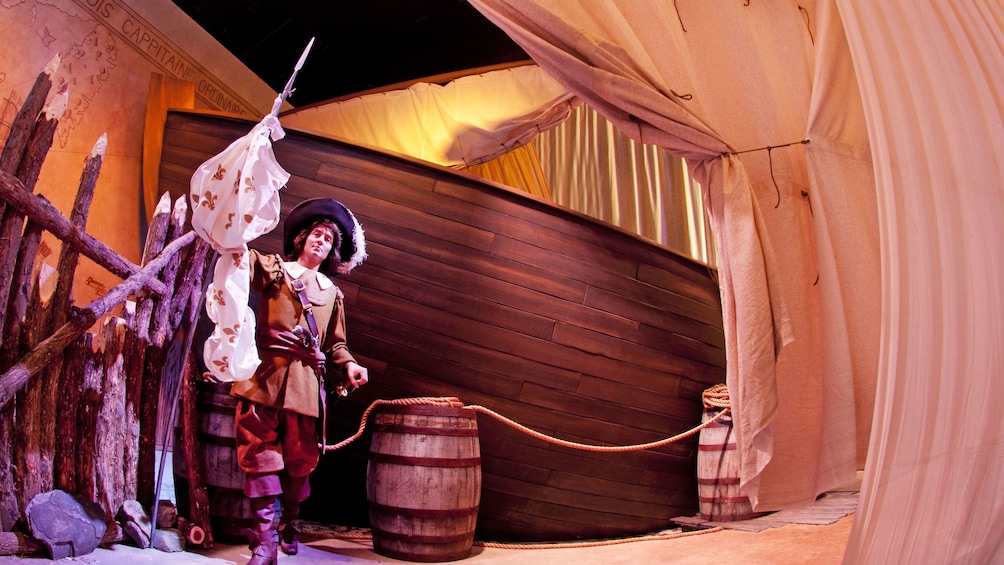 Wax statue set with a Pirate standing next to barrels and pikes