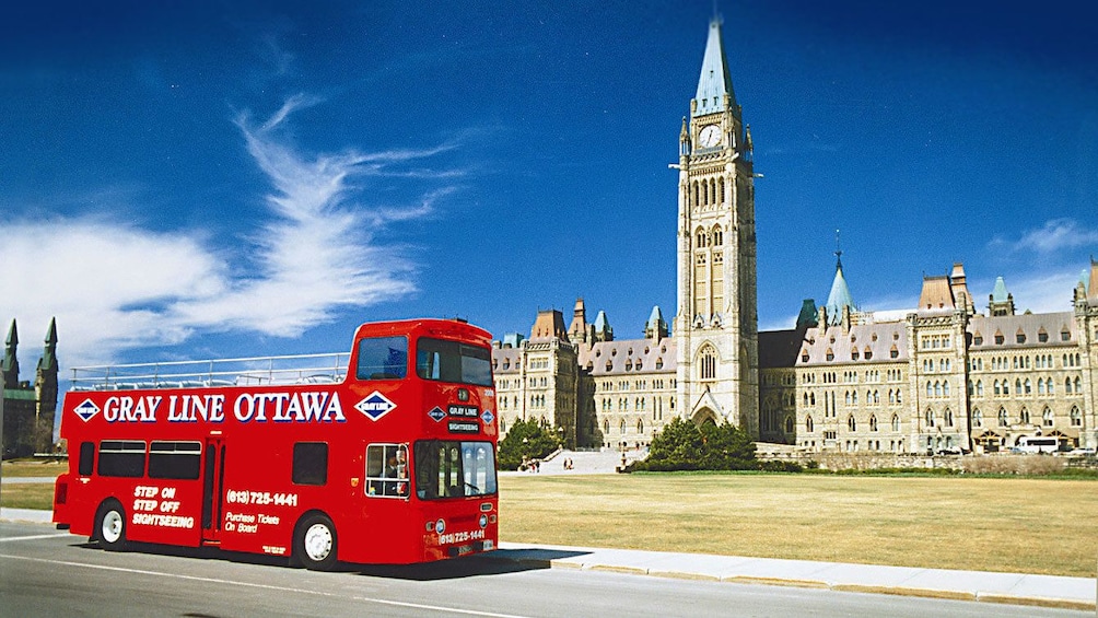 Hop-On Hop-Off bus in front of the Centre Block and Peace Tower in Ottawa