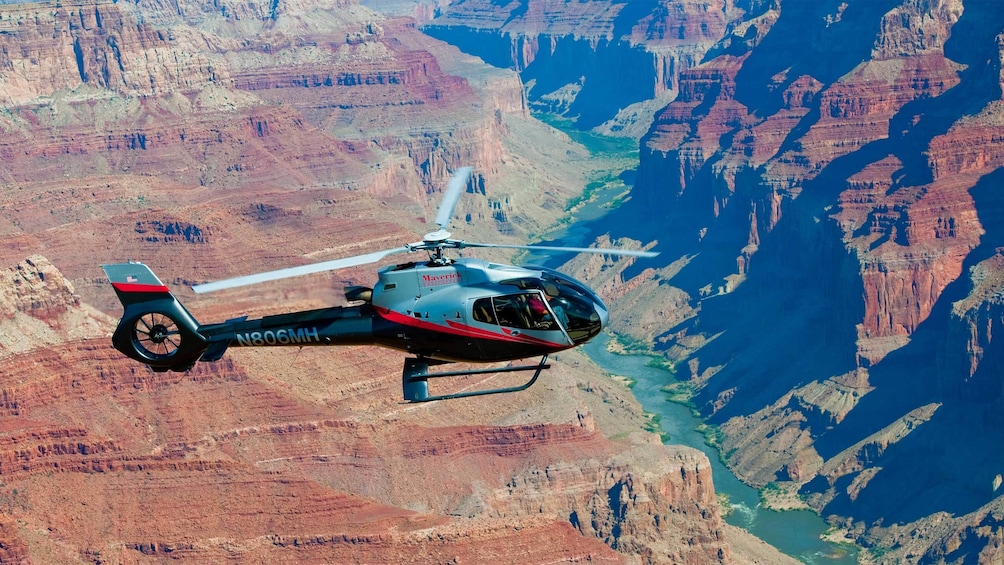Helicopter flying above the Grand Canyon during the day 
