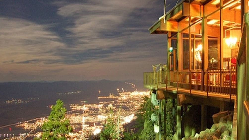 View from the Palm Springs Aerial Tram high above the city lit up at night in California