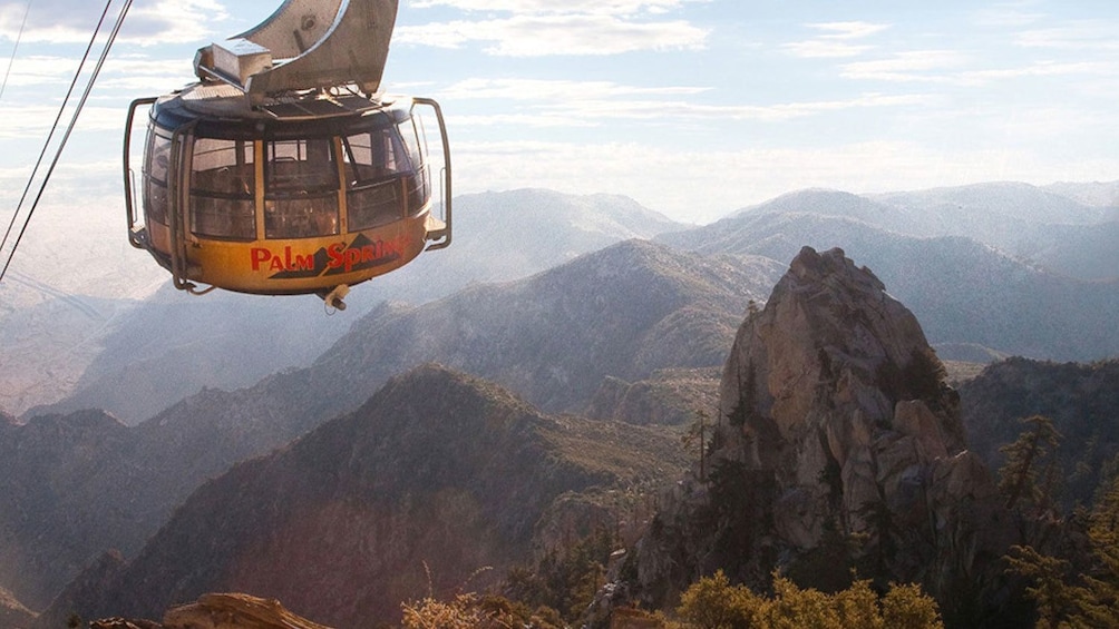 Aerial tram traveling high above the cliffs of Chino Canyon in California