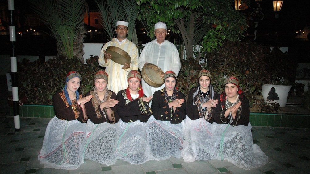 Dancers and musicians in traditional costumes in Marrakech