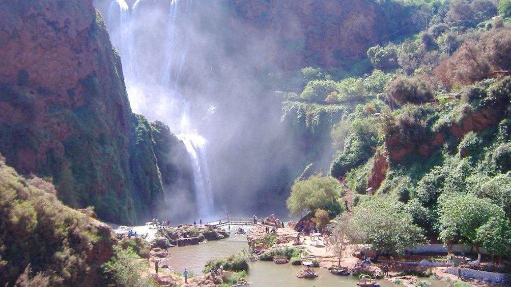 Waterfall and river with rafts in Ourika Valley