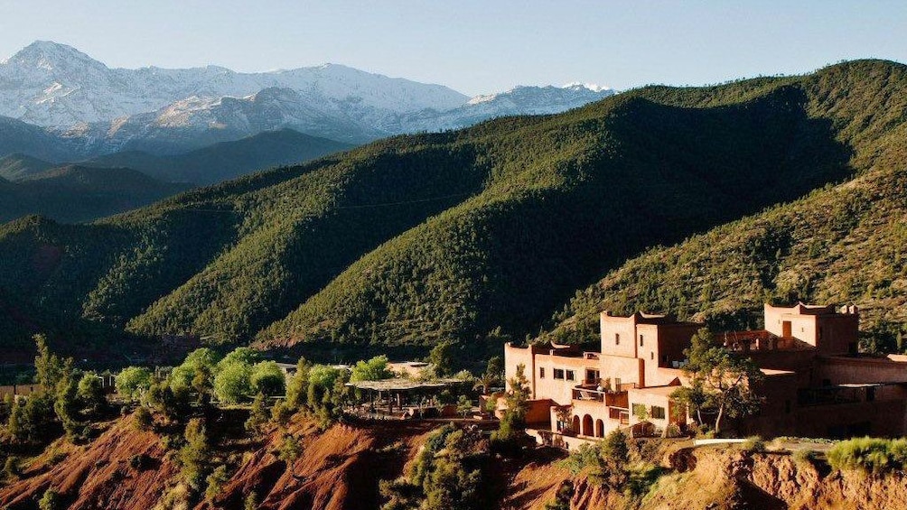 Berber village nestled in the rolling green foothills of the Atlas Mountains in Ourika