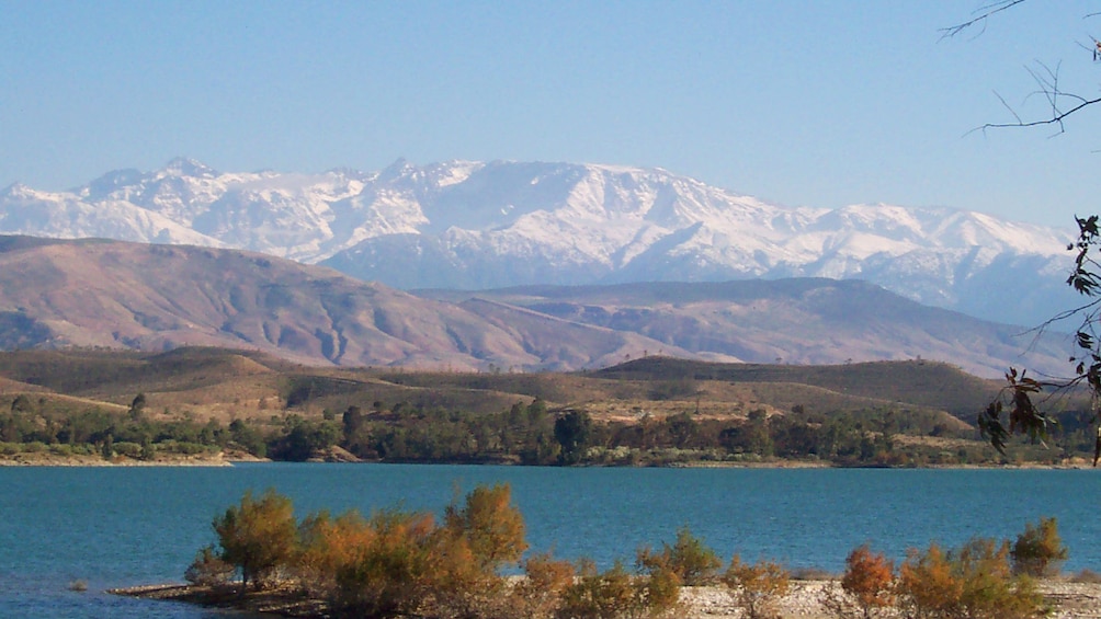 Lake with the rolling foothills and Atlas Mountains in the background in Marrakech