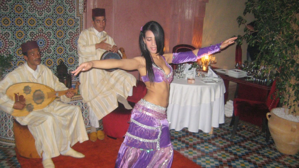 Belly dancer and musicians during a performance in Marrakech