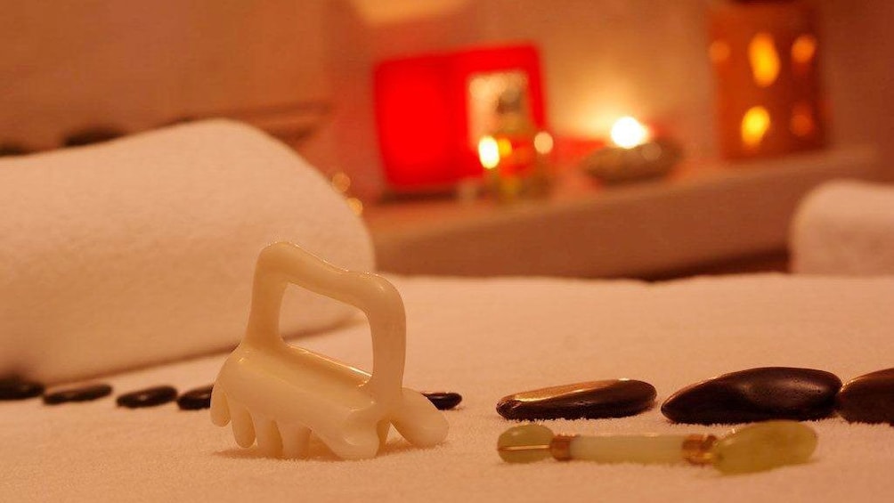 Stone massage tools on a massage table at a spa in Marrakech