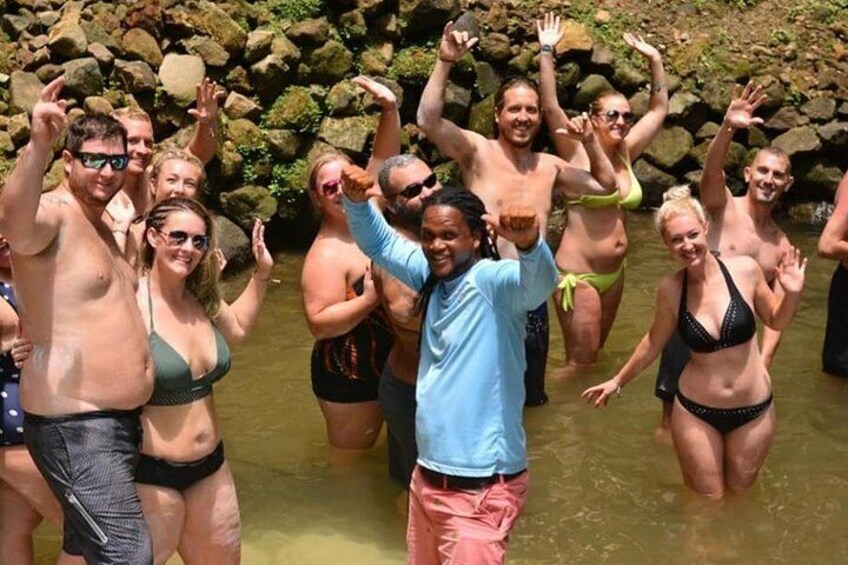 Group having fun at the waterfall