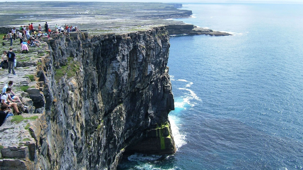 Sitting on the steep cliffs in Ireland