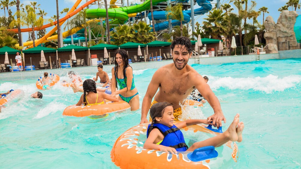Family plays in a wave pool in Knott's Berry Farm Soak City
