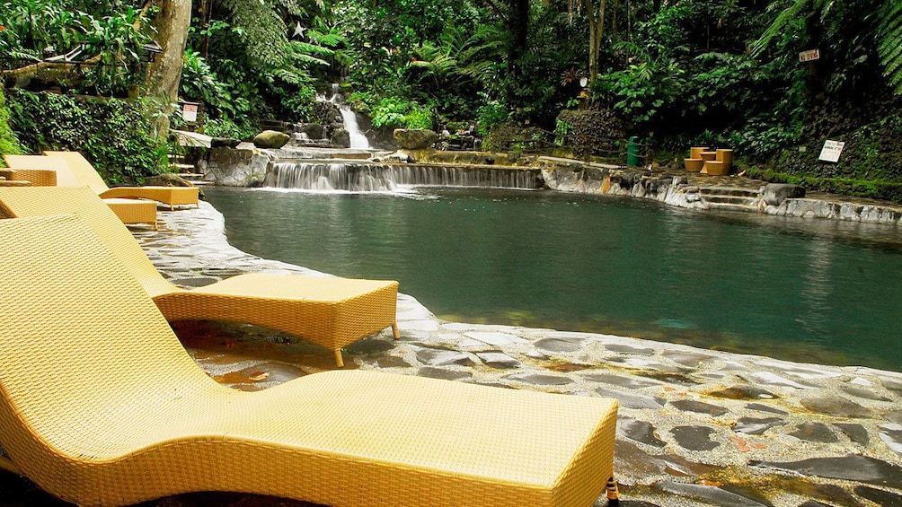 Chaise lounges along the hot spring pool at Hidden Valley Resort