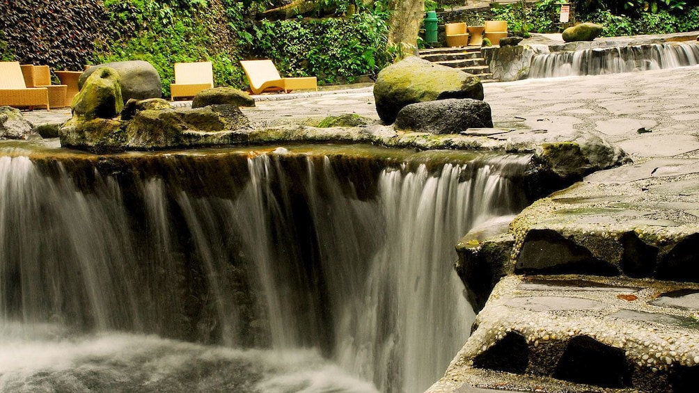 Small waterfall feeding the hot springs pool at Hidden Valley Resort