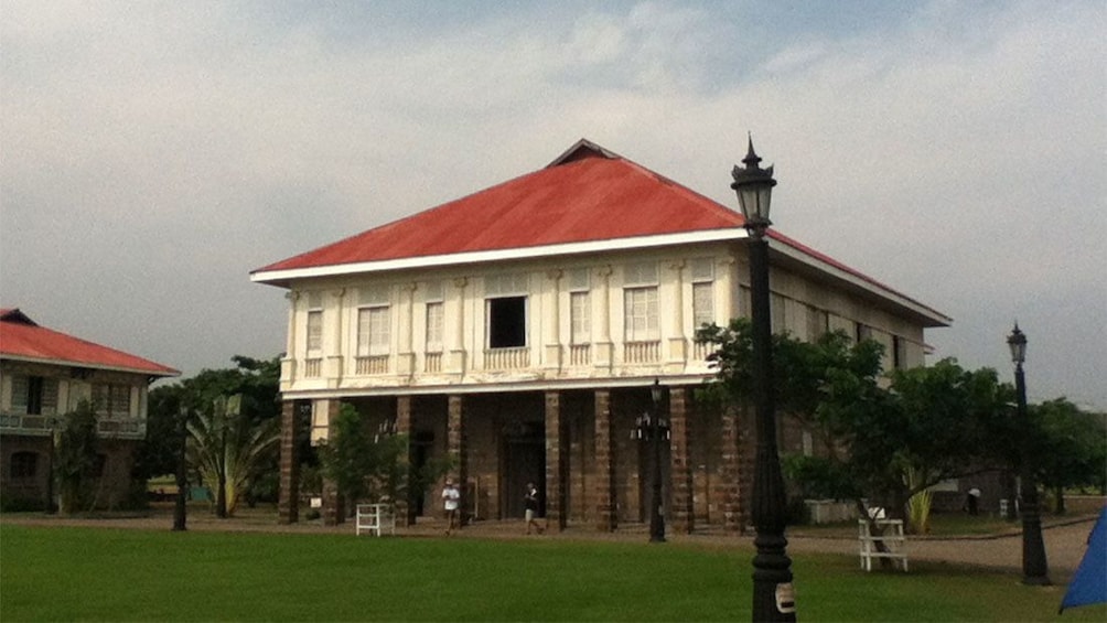 Old wood and brick two-story building at Las Casas Filipinas Resort in Manila