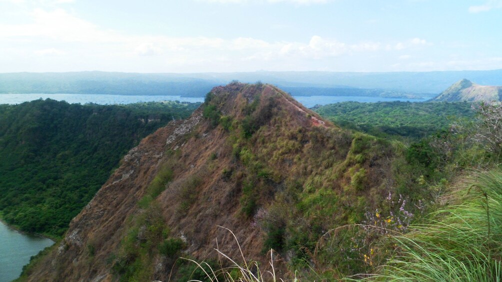 Tree covered cliffs along the edge of the Taal Volcano in Manila