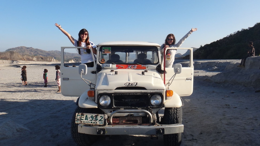 Pair of young women in a jeep in the Philippines