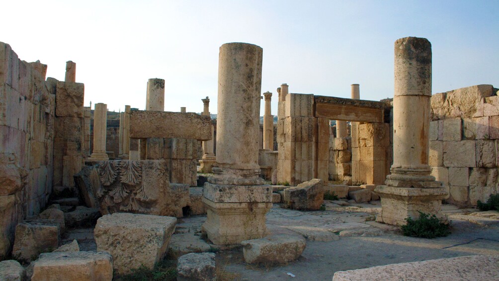 Pillars and arches of a ruined temple in Pompeii