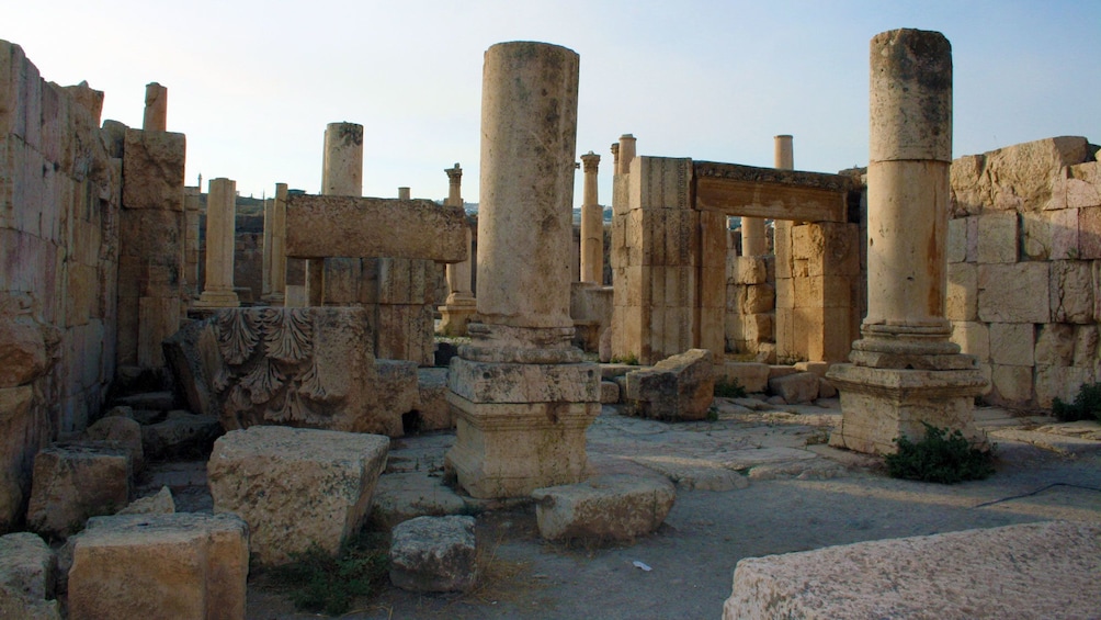Pillars and arches of a ruined temple in Pompeii