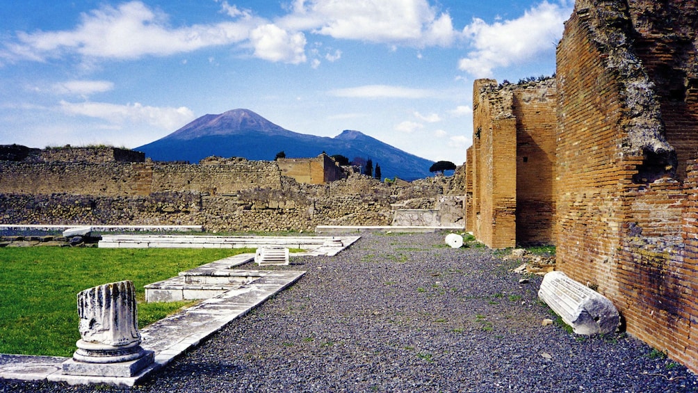 The ruins of Pompeii with Mount Vesuvius in the distance