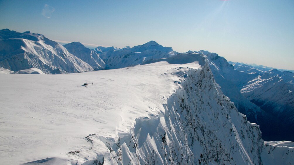 Aerial view of Helicopter on snowy mountain top