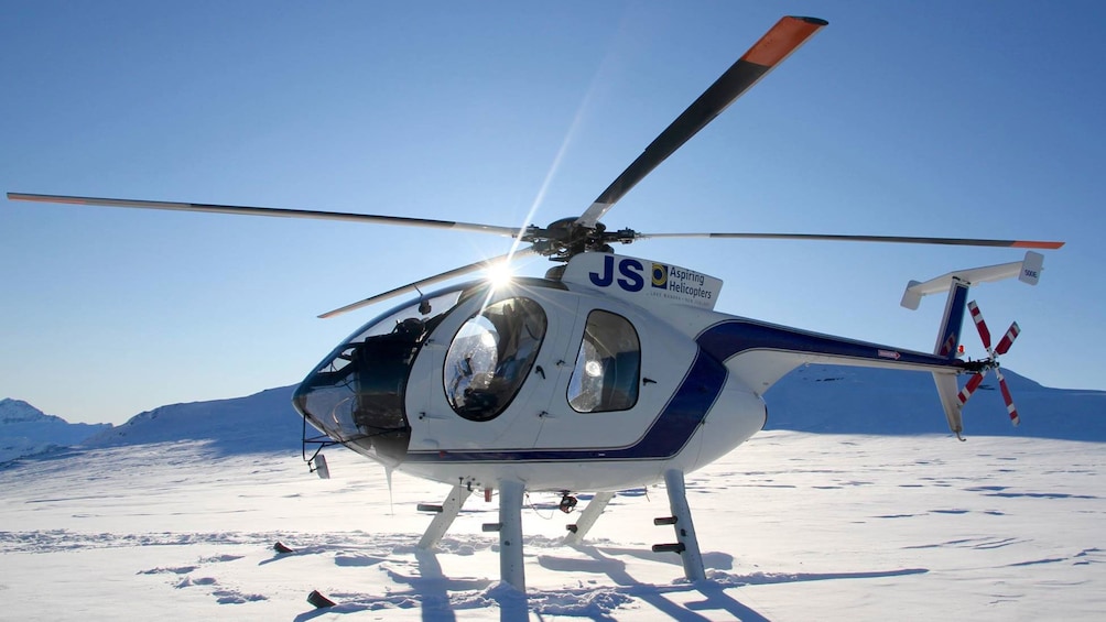 Helicopter on a snowy mountain top