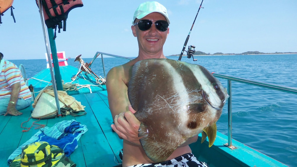 Man holding large fish in Koh Samui