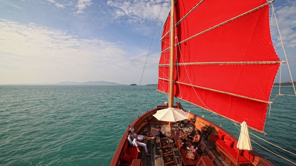 Sail boat with red sail in Koh Samui