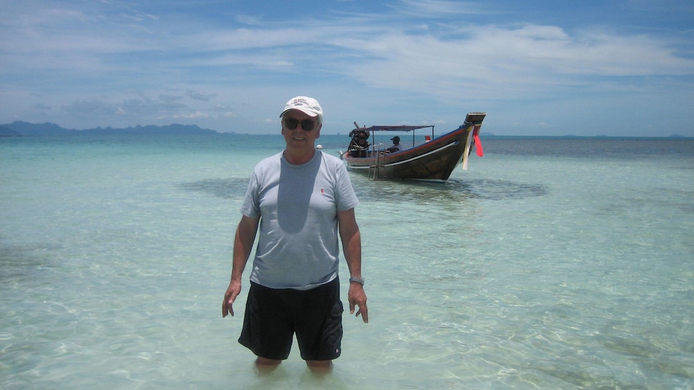 Man standing in the water in Koh Samui