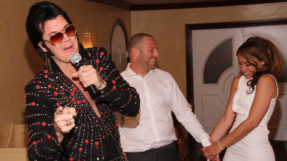 Elvis serenading the happy bride and groom during their wedding ceremony