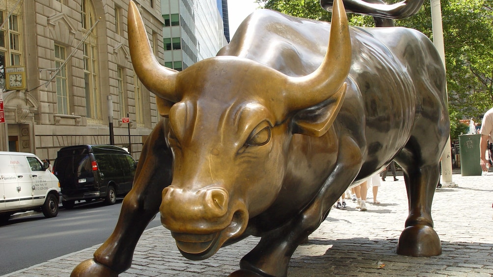Bronze charging bull sculpture on Wall Street in New York