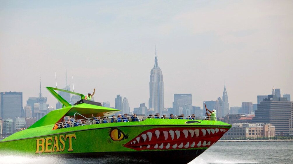 Beast speedboat on the water with the Empire State Building in the background in New York