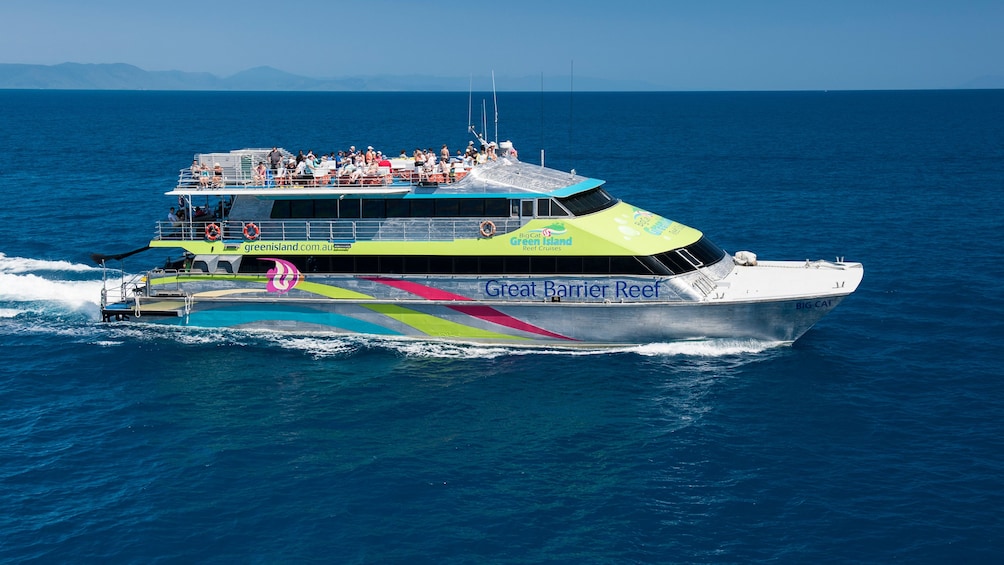 Tour group on catamaran cruise to stunning coral reefs in Cairns 