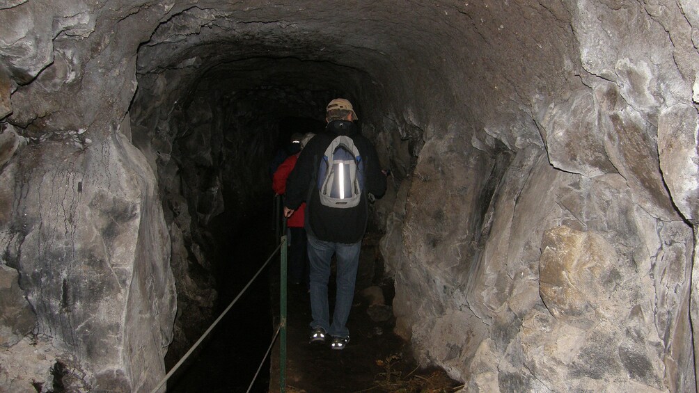 People walking through a levada in Madeira