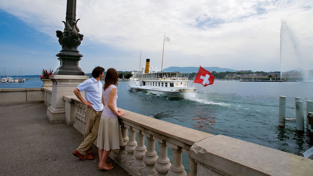 People observing boats in Geneva