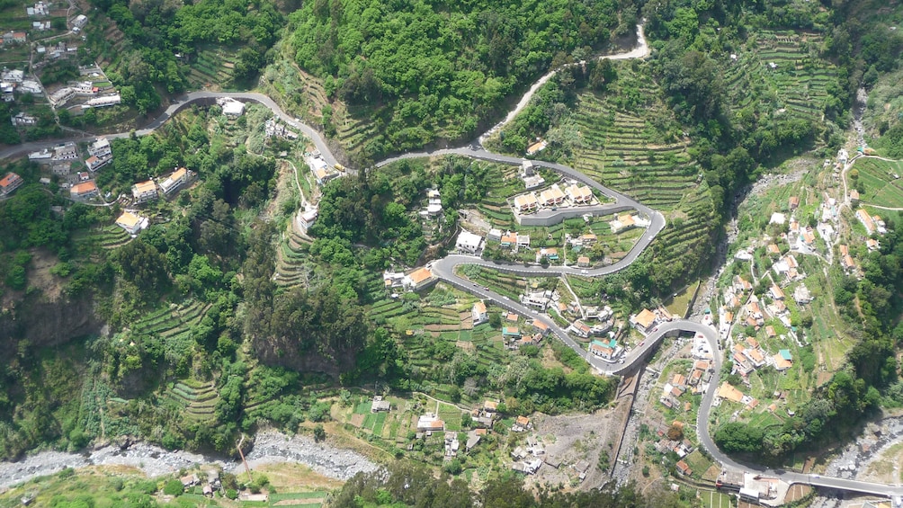 Looking down at villages and towns nestled in a valley in Madeira