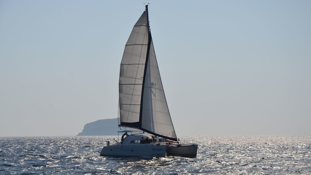 Calming view of a catamaran on Santorini waters