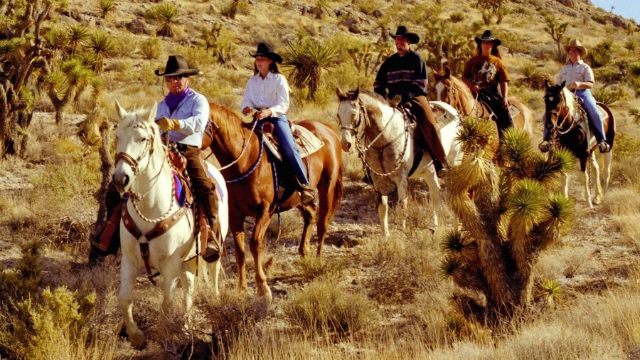 Horseback riders on a Wild West Horseback Riding tour in Las Vegas