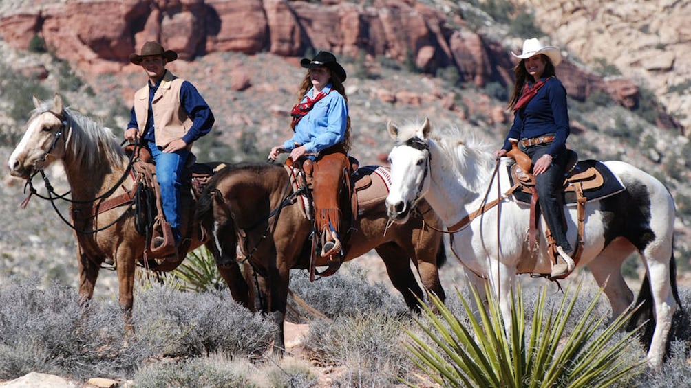 Three horseback riders on the Wild West Horseback Riding tour in Las Vegas 