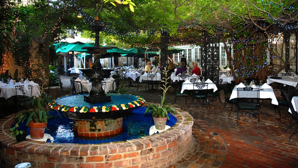 Show item 4 of 5. outdoor terrace dinning at Court of Two Sisters in New Orleans