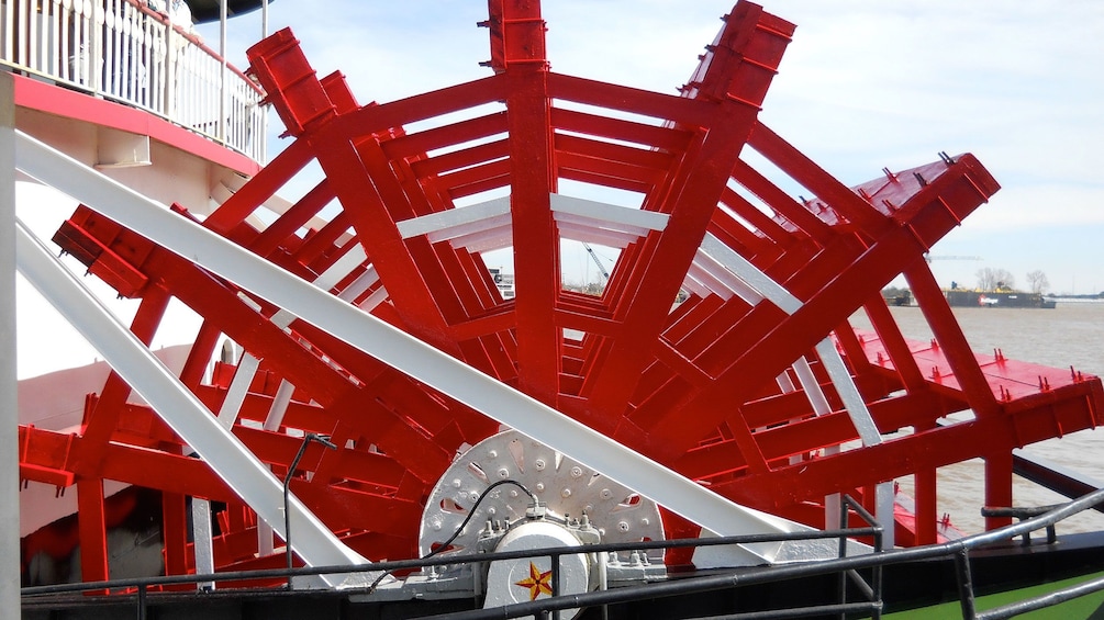 giant paddle wheel on steamboat in New Orleans
