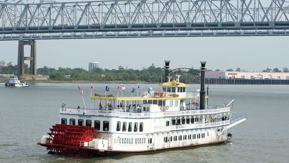 Paddleboat traveling down river in New Orleans