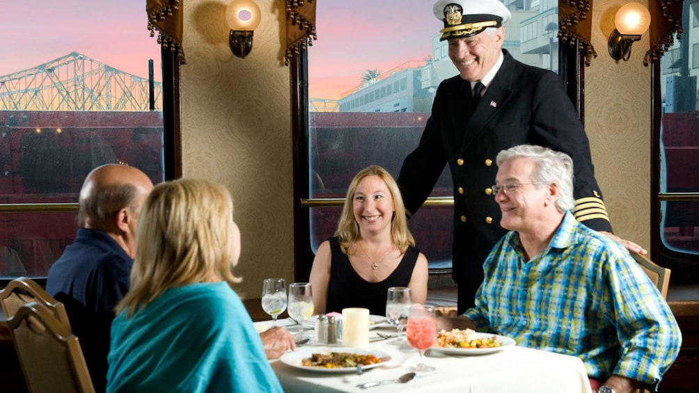 river boat talking to guest at dinner in New Orleans