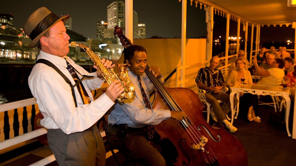 jazz musicians playing for crowd on river boat in New Orleans