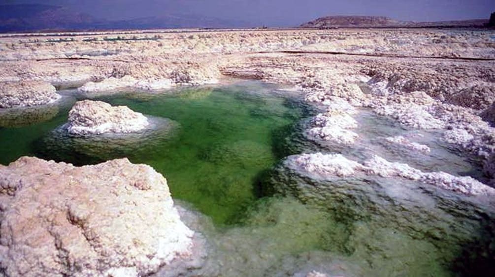 salt covered rock formations of the dead sea