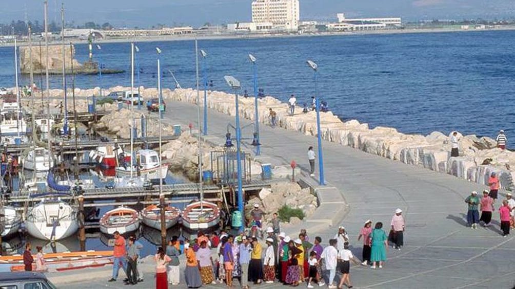 People walking along the waterfront in Acre